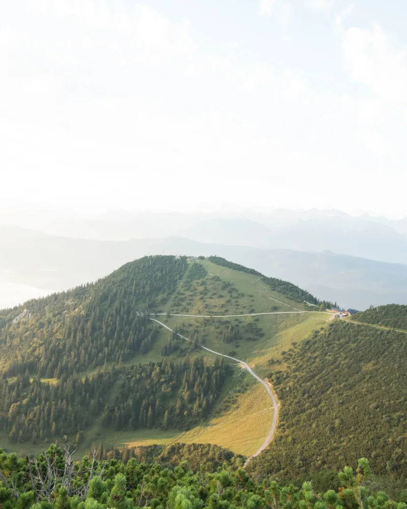 A clear view over green mountain ridges to the horizon